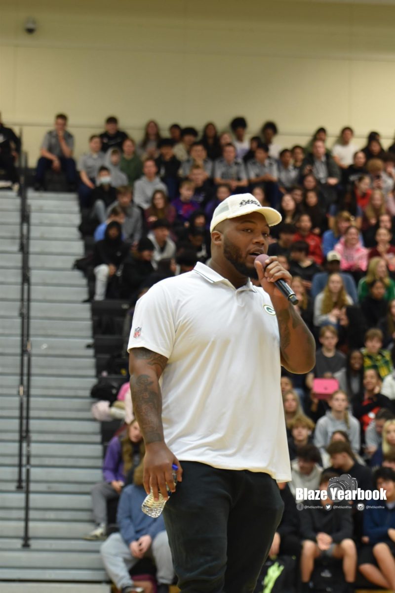 Kenny Clark addresses the student body during the 2024 Packers Tailgate Tour stop on April 10. 