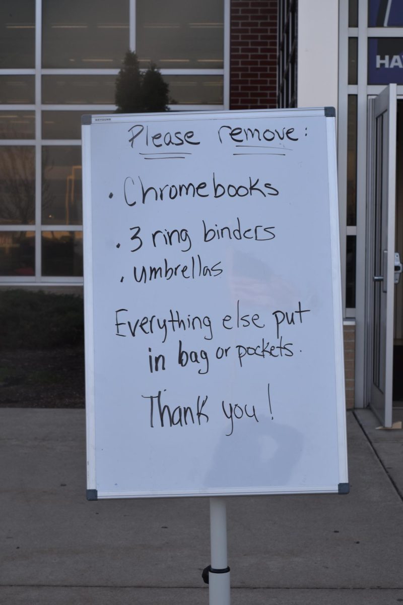 To get into the building, students have to pass signs describing what to take out of backpacks before going through the metal detectors. Leading up to the first day of the detectors, staff and students tested different items to see what would set them off. 